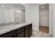 Bathroom boasts granite countertop and walk-in shower at 341 Maple St, Bennett, CO 80102