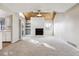 Bright living room with a stone fireplace and vaulted ceiling at 12602 E Warren Dr # D, Aurora, CO 80014