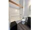 Bathroom with shower/tub combo and updated flooring at 17136 E Tennessee Dr, Aurora, CO 80017