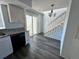 Dining area with gray flooring and view of kitchen and stairs at 17136 E Tennessee Dr, Aurora, CO 80017