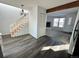 Dining area with stairs, hardwood floors, and view into living room at 17136 E Tennessee Dr, Aurora, CO 80017