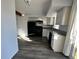 Kitchen with black appliances and granite countertops at 17136 E Tennessee Dr, Aurora, CO 80017