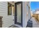 Modern front door with glass panel and sleek design, next to a walkway at 1312 Stuart St, Denver, CO 80204