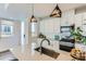 Modern kitchen with island, stainless steel appliances, and white cabinets at 1312 Stuart St, Denver, CO 80204