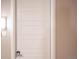 White apartment door with a simple, modern design at 12983 W Ida Ave # 309, Littleton, CO 80127