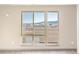 Bedroom with large windows offering mountain and neighborhood views at 12983 W Ida Ave # 309, Littleton, CO 80127