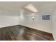 Finished basement with laminate floors and recessed lighting at 8311 Ogden St, Denver, CO 80229