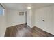 Finished basement bedroom with laminate floors and closet at 8311 Ogden St, Denver, CO 80229