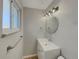 Updated bathroom with modern vanity and fixtures at 8311 Ogden St, Denver, CO 80229