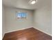 Simple bedroom with hardwood floors and closet at 8311 Ogden St, Denver, CO 80229