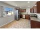 Modern kitchen with stainless steel appliances and granite countertops at 8311 Ogden St, Denver, CO 80229