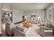 Virtually staged living room featuring hardwood floors and neutral decor at 8311 Ogden St, Denver, CO 80229
