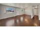 Spacious living room with hardwood floors and large windows at 8311 Ogden St, Denver, CO 80229