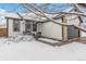 Front view of a ranch home with a snow-covered yard at 2206 E 97Th Ave, Thornton, CO 80229