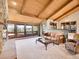 Living room with vaulted wood ceilings, stone fireplace and views at 1359 Pomegranate Ln, Golden, CO 80401