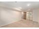 Spacious finished basement with mirrored closet and neutral carpeting at 11856 W Maplewood Ave, Littleton, CO 80127