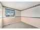 Well-lit bedroom with carpet and window at 11856 W Maplewood Ave, Littleton, CO 80127