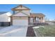 Two-story house with attached garage and landscaped yard at 11856 W Maplewood Ave, Littleton, CO 80127