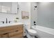 Stylish basement bathroom with a bathtub and modern vanity at 1231 Perry St # 2, Denver, CO 80204