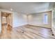 Bright living room with hardwood floors and access to the entryway at 23902 E 40Th Ave, Aurora, CO 80019