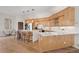 Modern kitchen with light wood cabinets, stainless steel appliances, and an island at 175 Harrison St, Denver, CO 80206