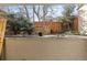 Stone patio with landscaping and a view of the fenced backyard at 175 Harrison St, Denver, CO 80206