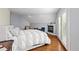 Bright bedroom featuring a cozy fireplace, hardwood floors, and French doors leading to outdoor space at 175 Harrison St, Denver, CO 80206