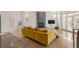Spacious living area with a mustard yellow couch and a modern fireplace at 175 Harrison St, Denver, CO 80206