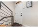 Clean entryway with white door and neutral colored walls at 175 Harrison St, Denver, CO 80206