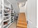 Built-in shelving with books and a staircase to the upper floor at 175 Harrison St, Denver, CO 80206