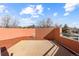 Rooftop deck with city views and small table at 175 Harrison St, Denver, CO 80206