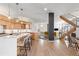 Open concept kitchen with island, stainless steel appliances and hardwood floors at 175 Harrison St, Denver, CO 80206