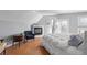 Main bedroom with fireplace, hardwood floors and access to balcony at 175 Harrison St, Denver, CO 80206