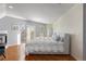 Main bedroom with hardwood floors, a fireplace and private balcony at 175 Harrison St, Denver, CO 80206