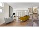 Open living room with hardwood floors, fireplace, and access to patio at 175 Harrison St, Denver, CO 80206