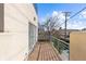 Private deck with wood flooring and metal railing at 175 Harrison St, Denver, CO 80206