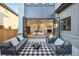 Outdoor patio with seating area and a view into the living room at 2504 Zenobia St, Denver, CO 80212