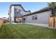 Modern home with a large backyard, grassy lawn, and patio at 2504 Zenobia St, Denver, CO 80212