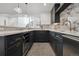 Basement wet bar with marble backsplash and dark cabinetry at 2504 Zenobia St, Denver, CO 80212