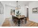 Bright dining room featuring a rustic wood table and modern light fixture at 2504 Zenobia St, Denver, CO 80212