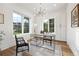 Bright home office with built-in shelving and large windows at 2504 Zenobia St, Denver, CO 80212