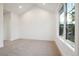 Spacious bedroom with carpeted floor and large window at 2504 Zenobia St, Denver, CO 80212