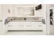 Modern bathroom with double vanity and a large mirror at 4200 W 17Th Ave # 618, Denver, CO 80204