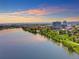 Aerial view of community, lake, and city skyline at 4200 W 17Th Ave # 618, Denver, CO 80204