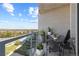 Private balcony with city and lake views, seating for four at 4200 W 17Th Ave # 618, Denver, CO 80204