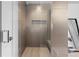 Sleek walk-in shower with neutral tile and built-in seating at 4200 W 17Th Ave # 618, Denver, CO 80204