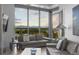 Modern living room with floor-to-ceiling windows and mountain views at 4200 W 17Th Ave # 618, Denver, CO 80204
