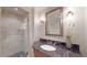 Bathroom with a walk-in shower and marble finishes at 1891 Curtis St # 1613, Denver, CO 80202