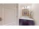 Elegant powder room with marble vanity and frameless mirror at 1891 Curtis St # 1613, Denver, CO 80202
