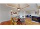 Formal dining area with hardwood floors and a modern light fixture at 1891 Curtis St # 1613, Denver, CO 80202